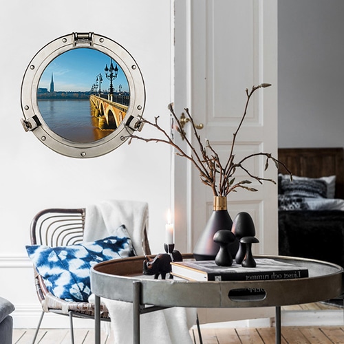 sticker Toits de Paris au-dessus d'un fauteuil gris et lampe design