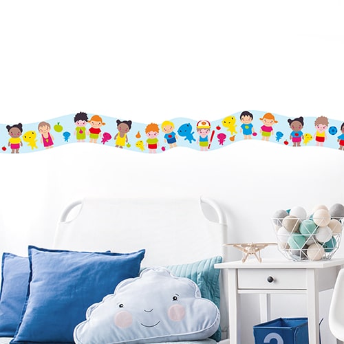 Sticker frise enfants du monde dans chambre d'enfant avec coussins bleus