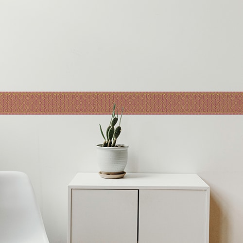 Sticker frise feuille rouge et jaune sur mur blanc