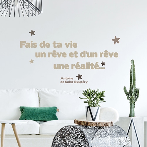 Sticker citation - Phrase de Saint-Exupéry au-dessus d'un canapé blanc - 