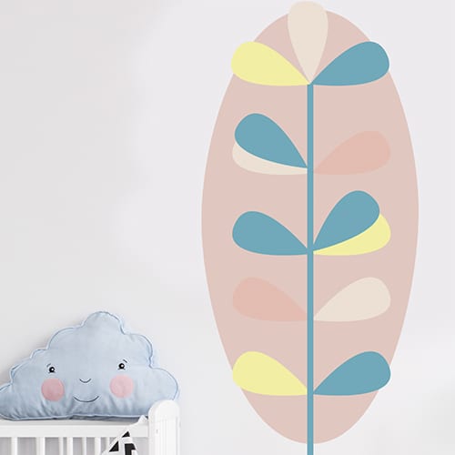 Autocollant mural feuille pour enfants mis en ambiance sur un mur blanc d'une chambre de bébé