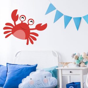 Sticker Crabe rouge enfants mis en ambiance sur le mur blanc d'une chambre pour enfants avec décorations bleues