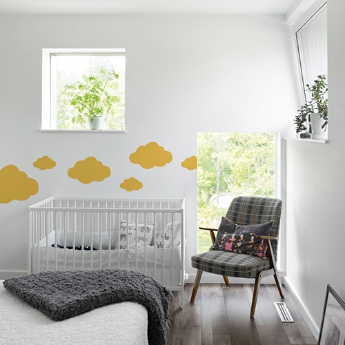 Autocollant mural animal pour enfant mis en ambiance dans une chambre pour bébé