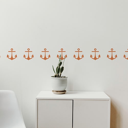 Bandes de stickers ancre orange mis en ambiance sur fond blanc