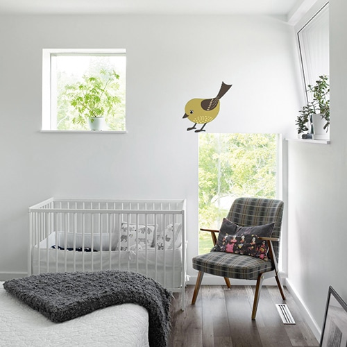 Adhésif mural oiseau pour enfant mis en ambiance dans une chambre pour bébé