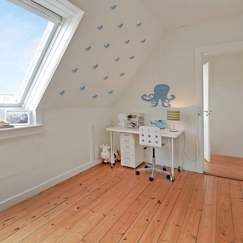 Mosaïque de stickers muraux pieuvre bleue pour enfant sur le mur blanc d'un bureau pour enfant