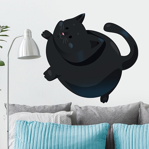 Grand autocollant mural pour enfants Chat noir mis en ambiance sur un mur blanc