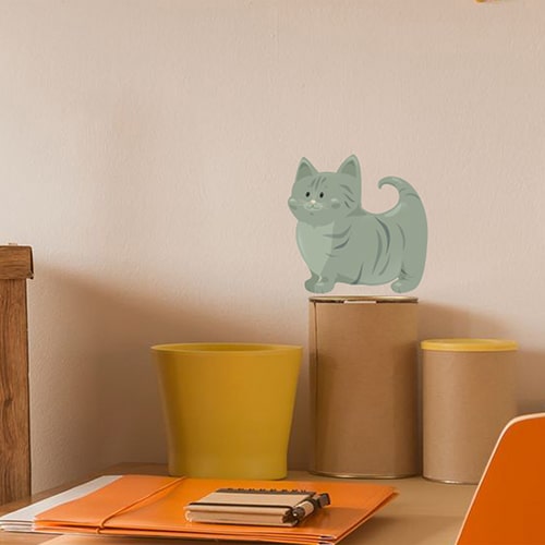 Autocollant mural pour enfants Chat vert mis en ambiance sur un mur clair