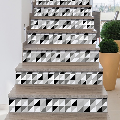 Sticker autocollant Papillons scandinave chevrons 3D sur un mur blanc avec une fenêtre et une horloge en bois