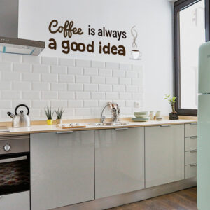 Sticker marron citation coffee is always a good idea collé dans une cuisine