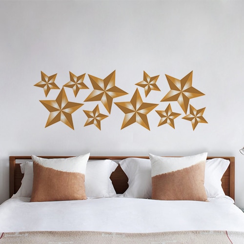 Sticker planche Etoiles dorées au dessus d'un lit