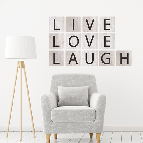 Sticker mural Live Love Laugh Noir sur fond gris dans un salon