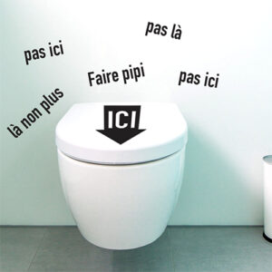 Sticker rigolo Faire pipi ici collé sur des toilettes modernes