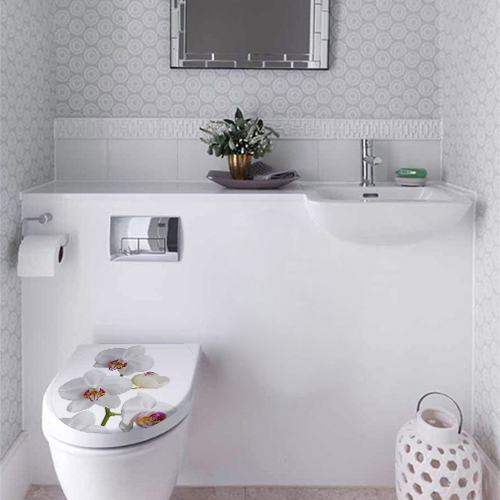Sticker adhésif Orchidée pour décorer collé sur des toilettes blancs