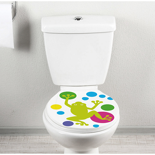 Abattant de toilette orné d'un sticker grenouilles