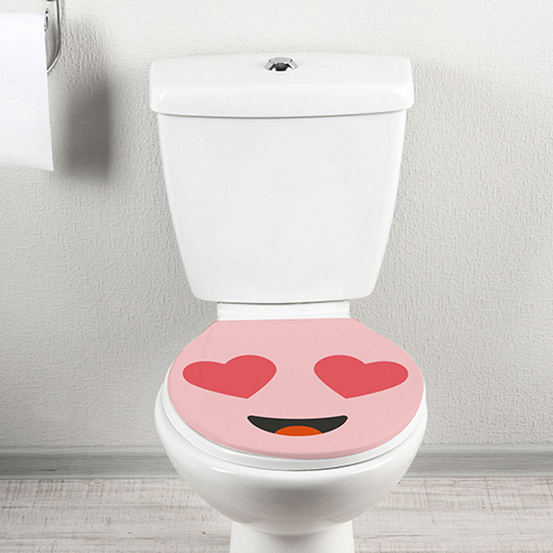 Smiley Amoureux rose décoratif collé sur un WC des plus classiques