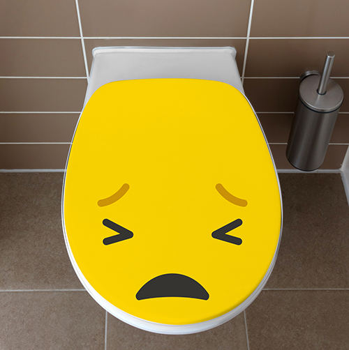 Abattant de toilettes blanche ornée d'un sticker Smiley Pas content jaune