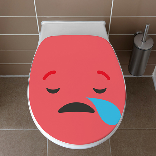 Abattant de WC orné d'un sticker de la gamme Smiley : le smiley triste rouge vu de dessus
