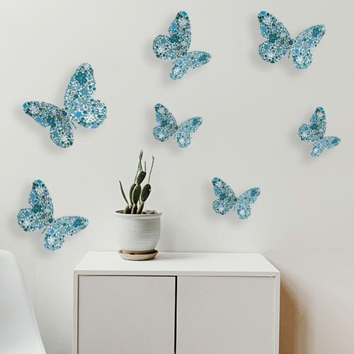 Sticker autocollant 3D Papillons bleus collés sur un mur dans une pièce à vivre