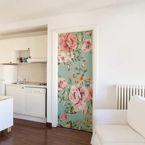 Salon tout blanc avec un sticker adhésif autocollant modèle fleurs roses collé sur la porte
