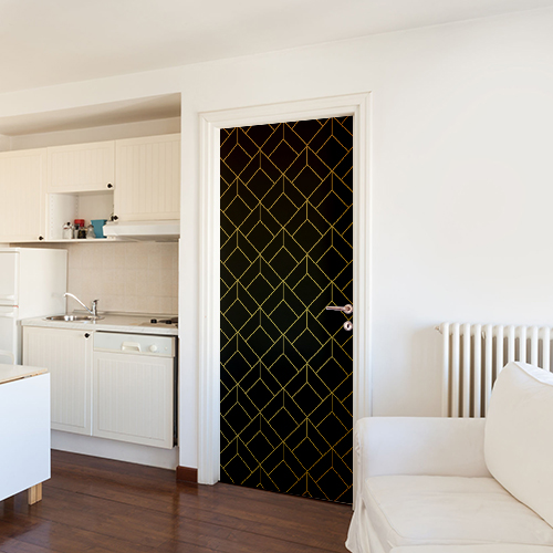 Salle de cuisine blanche avec un sticker déco noir et or collé sur la porte