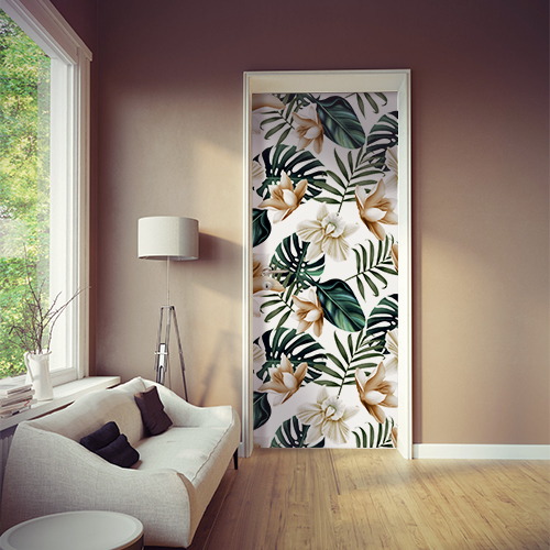 Séjour personnalisé avec une touche jungle grâce au sticker pour portes et placards motif lotus et feuille de monstera.
